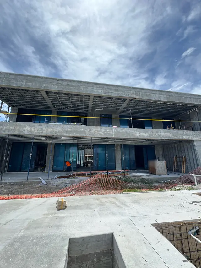 Residential project under construction with impact windows already installed