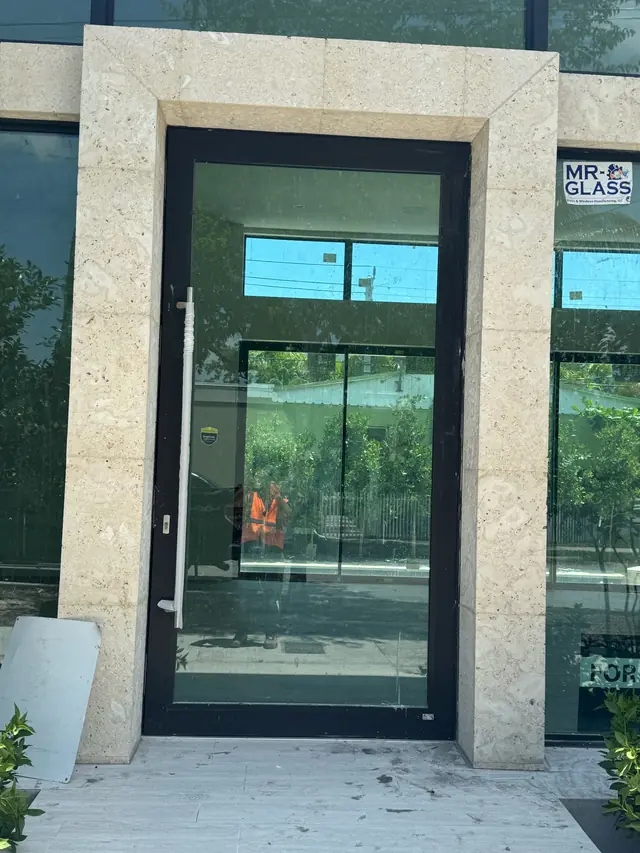 Black-frame impact glass commercial door